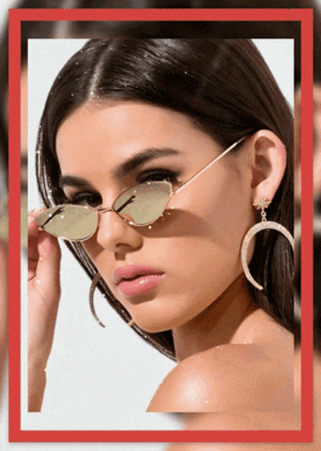 a woman wearing a pair of sunglasses and earrings