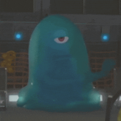 a blue monster with one eye is standing in a room