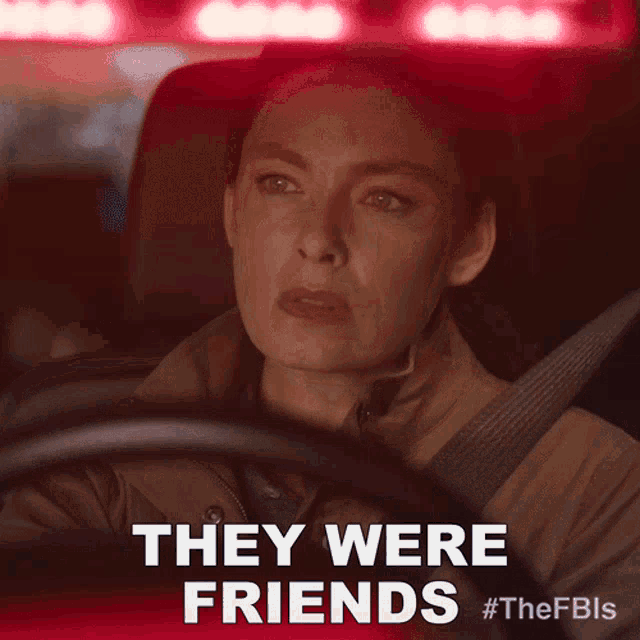 a woman driving a car with the words they were friends