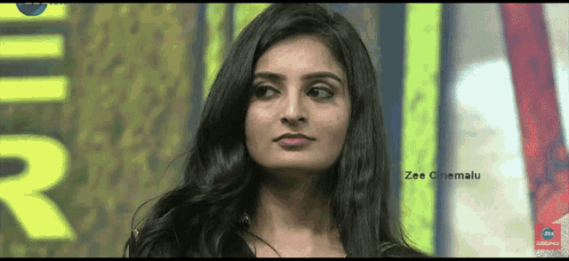 a close up of a woman 's face with the words zee cinemalu on the bottom right