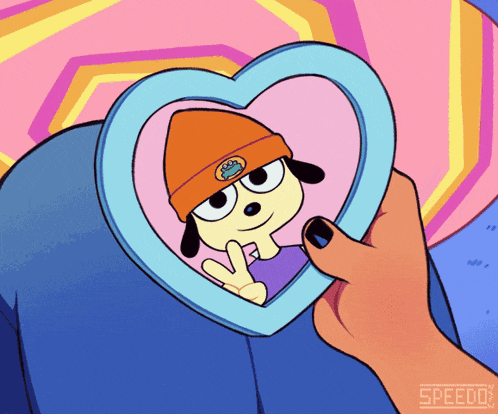 a person is holding a heart shaped picture frame with a cartoon character on it