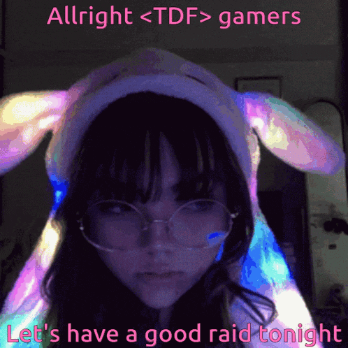 a girl wearing a bunny hat and glasses says allright < tdf > gamers