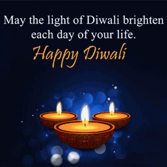 a happy diwali card with three lit candles