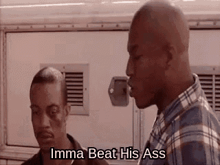 two men are standing next to each other and talking .