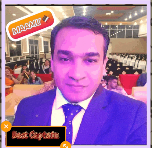 a man in a suit and tie with a sticker that says maamu