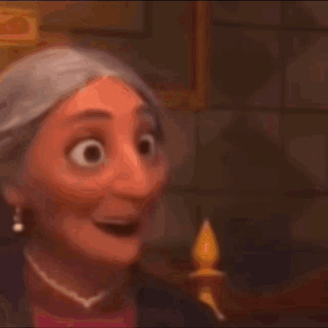 a close up of a cartoon character with gray hair and a yellow shirt making a funny face .