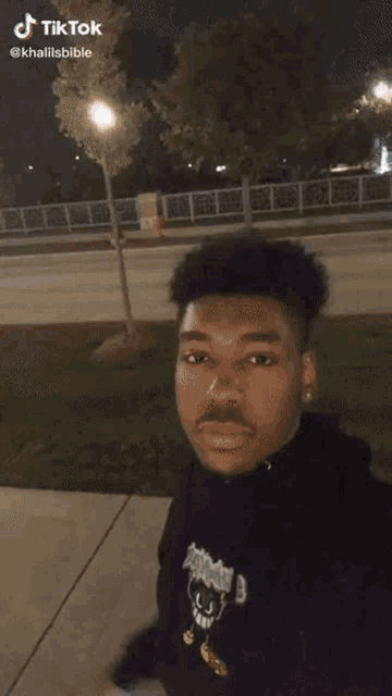 a man is jumping over a brick wall with a tiktok watermark