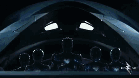 a group of power rangers standing next to each other with the words go go on the bottom