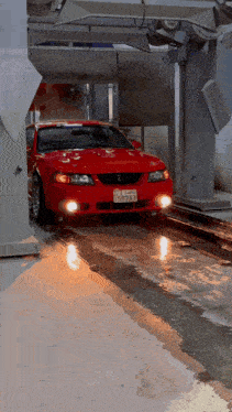 a red mustang with a license plate that says 5923