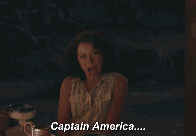 a woman with her arms outstretched and the words captain america below her