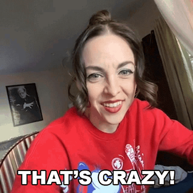 a woman in a red shirt says that 's crazy !