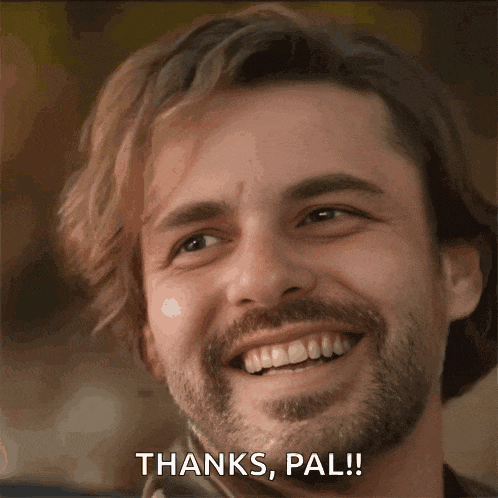 a man with a beard is smiling with the words thanks pal behind him