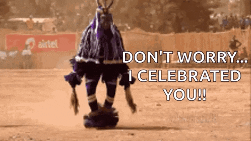 a man in a purple and blue costume is dancing in front of a crowd and a sign that says airtel