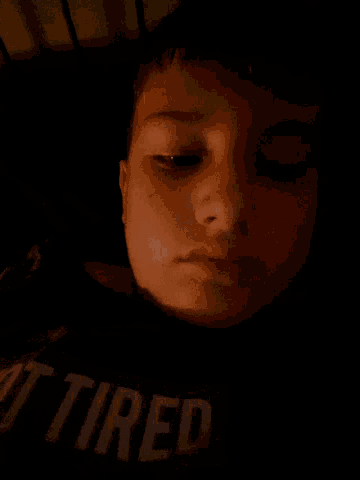 a close up of a person 's face with their eyes closed