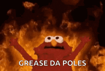 elmo is standing in front of a fire with the words `` grease da poles '' written on it .