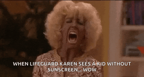 a woman is screaming with her mouth open while wearing a sunscreen .