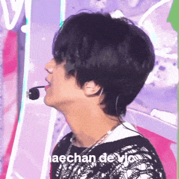 a close up of a person 's face with the words haechan devi on the bottom left