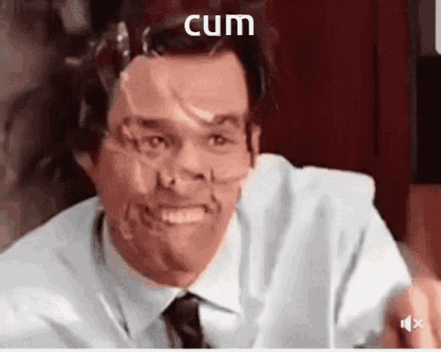 a man with duct tape on his face and the word cum on the bottom .