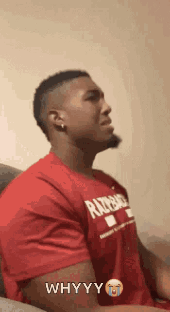 a man wearing a red shirt that says razorback
