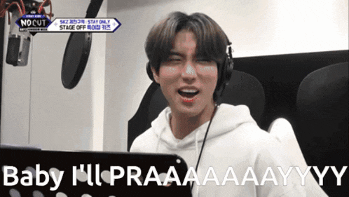 a man wearing headphones says " baby i 'll praaaayyy "