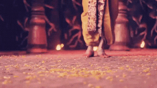 a person 's feet are shown in a blurry photo while standing on a stage .