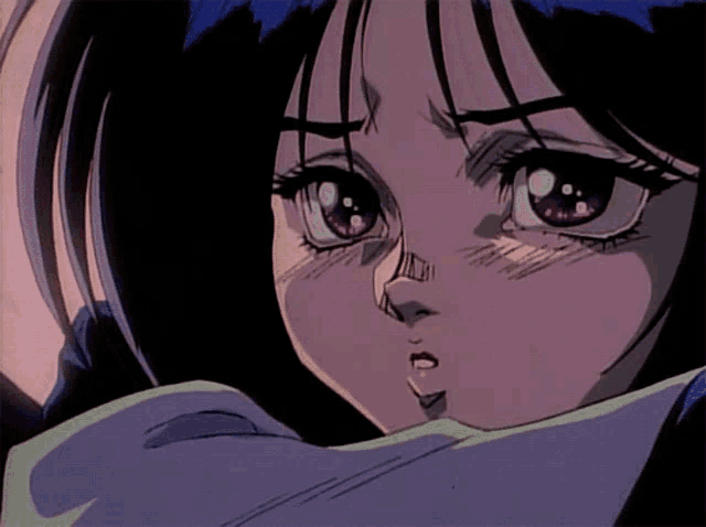 a close up of a cartoon character 's face with purple eyes