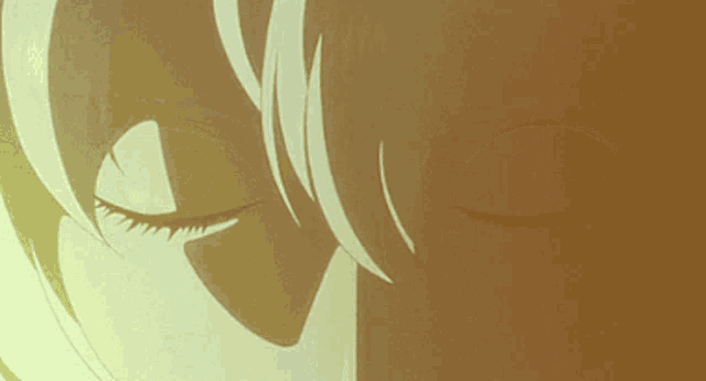 a close up of a person 's eyes with a yellow background