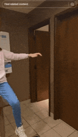 a girl is dancing in a hallway with a search bar that says find related content at the top