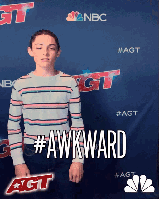 a person standing in front of a sign that says nbc