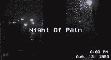 a black and white photo of a window with the words `` night of pain '' written on it
