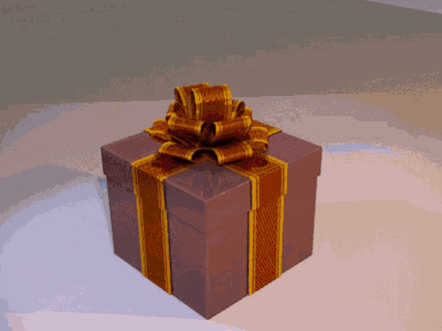a purple gift box with a red and gold bow
