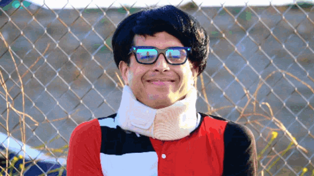 a man wearing sunglasses and a neck brace