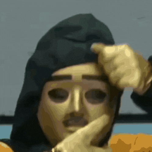 a close up of a person wearing a hood