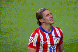 a man wearing a red and white striped shirt with the letter r on the front