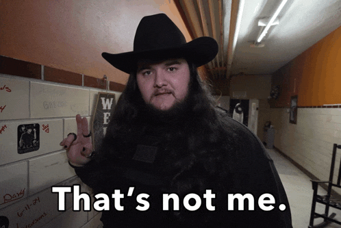 a man with long hair and a cowboy hat says " that 's not me "