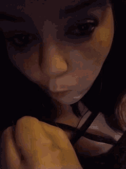 a close up of a woman licking a person 's foot .