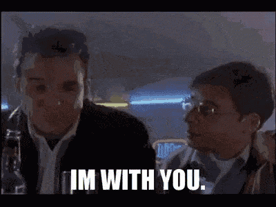 two men are standing next to each other and one of them is saying `` i 'm with you . ''