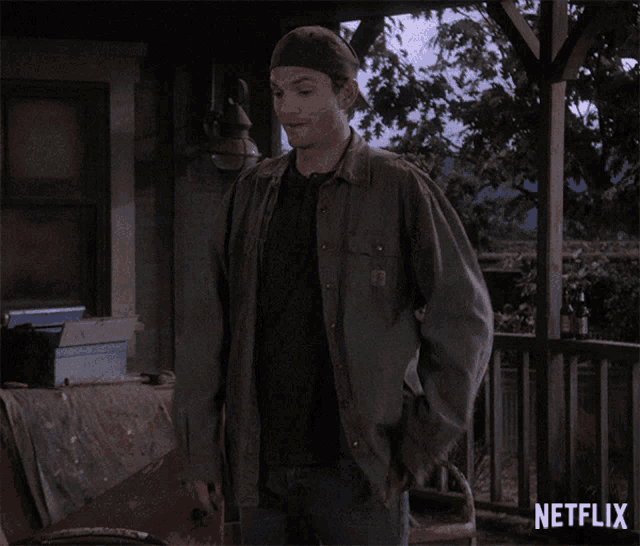 a man is dancing on a porch with a netflix logo in the corner