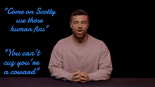 a man in a pink sweater says " come on scotty use those human fins " on a black background