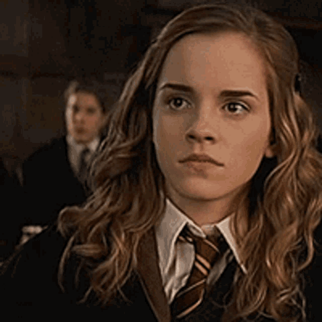 a close up of a girl wearing a tie