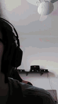 a person wearing a pair of glasses is looking at a clock on the wall