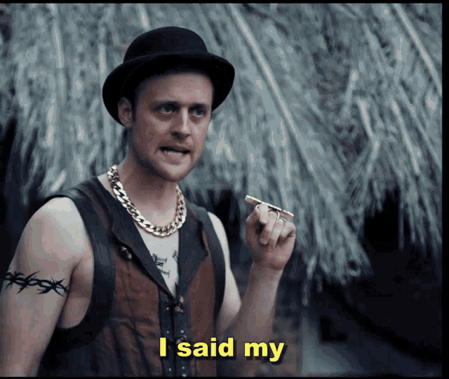 a man smoking a cigar with the words i said my below him