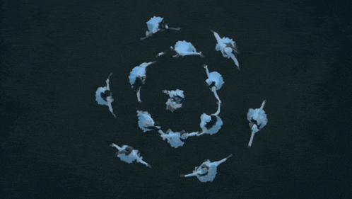 a group of people are dancing in a snowflake