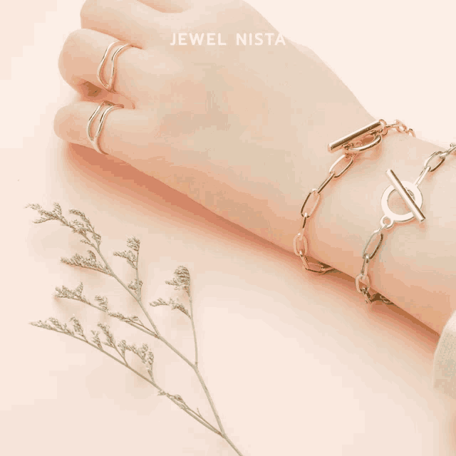 a close up of a person 's wrist with jewel nista written above it