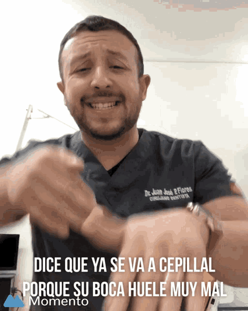 a man wearing a scrub top that says dr juan jose flores