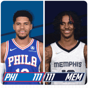 a philadelphia basketball player and a memphis basketball player standing next to each other