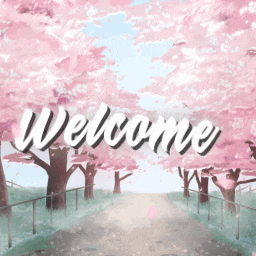 a sign that says welcome in front of a row of pink cherry blossom trees