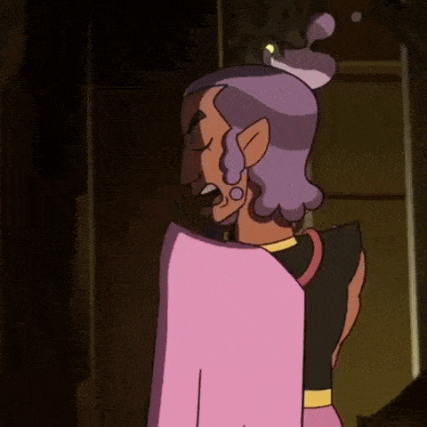 a cartoon character with purple hair and ears is wearing a pink dress and standing in a dark room .