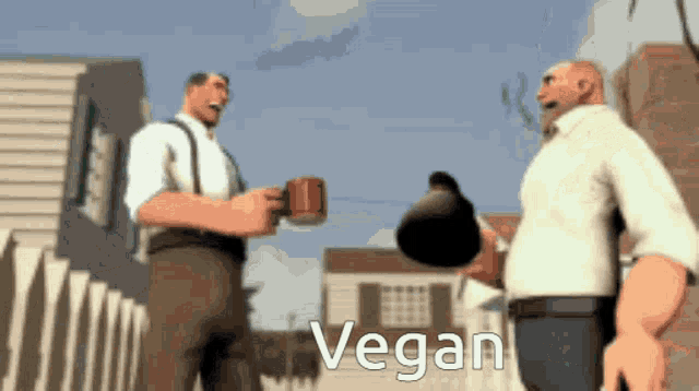 two men are standing next to each other and the word vegan is visible