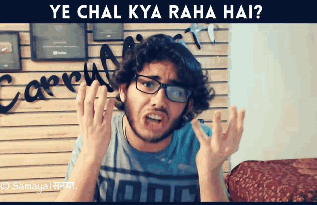 a man wearing glasses making a funny face with the words ye chal kya raha hai